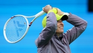  Iga Swiatek of Poland hits autographed balls into the crow after her straight sets victory against Caroline Garcia of France in their second round match during the BNP Paribas Open at Indian Wells Tennis Garden on March 07, 2025 in Indian Wells, California. (Photo by CLIVE BRUNSKILL / GETTY IMAGES NORTH AMERICA / Getty Images via AFP)