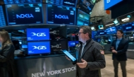 Traders work on the floor of the New York Stock Exchange in New York City.