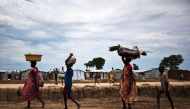 People walk through the UN base outside Bentiu, South Sudan, September 17, 2015. AFP, Tristan McConnell