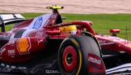 Ferrari's British driver Lewis Hamilton drives during the second practice session of the Formula One Australian Grand Prix at the Albert Park Circuit in Melbourne on March 14, 2025. (Photo by WILLIAM WEST / AFP)