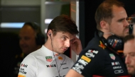 Red Bull Racing's Dutch driver Max Verstappen (L) looks on ahead of the second practice session of the Formula One Australian Grand Prix at the Albert Park Circuit in Melbourne on March 14, 2025. (Photo by Paul Crock / AFP)