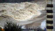 A picture shows the high level of the Arno river in Florence during floods in Tuscany, on March 14, 2025. Photo by Claudio GIOVANNINI / ANSA / AFP