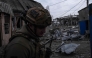 In this handout photograph taken on March 13, 2025 and released on March 14, 2025 by the press service of the 93rd Kholodnyi Yar Separate Mechanized Brigade of the Ukrainian Ground Forces, a Ukrainian serviceman stands among debris in an abandoned area in Pokrovsk, Donetsk region, amid the Russian invasion of Ukraine. (Photo by Handout / The 93rd Kholodnyi Yar Separate Mechanized Brigade / AFP) 