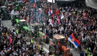 Farmers join protesters as they arrive in the capital from cities across Serbia, to take part in the largest protest since the anti-graft movement, in downtown Belgrade on March 15, 2025. (Photo by Andrej Isakovic / AFP)