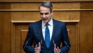 (Files) Greek Prime Minister Kyriakos Mitsotakis addresses the audience at the Greek Parliament in Athens, on March 5, 2025. (Photo by Angelos Tzortzinis / AFP)