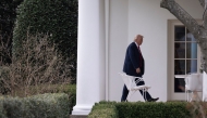 US President Donald Trump walks to the Oval Office at the White House in Washington, DC, on March 14, 2025 after speaking at the Justice Department. (Photo by ROBERTO SCHMIDT / AFP)