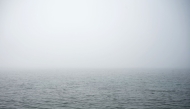 This photograph shows the sea covered in fog and dust at Palaio Faliro suburb, on the Saronic Gulf coast, south of Athens, on March 15, 2025. (Photo by Angelos TZORTZINIS / AFP)