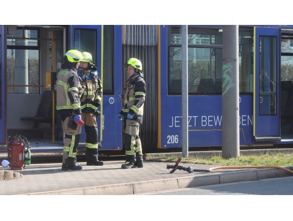 Fire fighters stand near a tram in Gera on March 16, 2025. Photo by Bodo Schackow / dpa / AFP