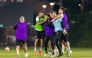 Al Sadd  players share a light moment during a training session on Sunday night.