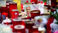 Candles are laid at the Gemelli hospital where Pope Francis is hospitalized with pneumonia, in Rome on March 17, 2025. (Photo by Tiziana FABI / AFP)