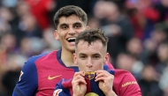 Barcelona's Spanish midfielder #17 Marc Casado (R) celebrates scoring his team's second goal next to Barcelona's Spanish defender #35 Gerard Martin during the Spanish league football match between FC Barcelona and Real Sociedad at Estadi Olimpic Lluis Companys in Barcelona on March 2, 2025. (Photo by LLUIS GENE / AFP)
