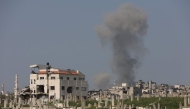 Smoke billows during Israeli strikes west of Gaza City on March 18, 2025. (Photo by Omar AL-QATTAA / AFP)
