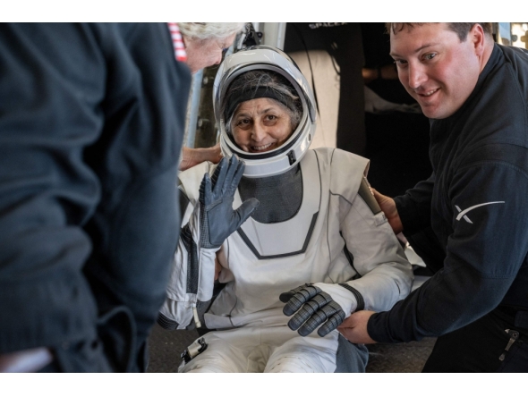 This photo provided by NASA shows NASA astronaut Suni Williams being helped out of a SpaceX Dragon spacecraft on board the SpaceX recovery ship MEGAN after she, NASA astronauts Nick Hague, Butch Wilmore, and Roscosmos cosmonaut Aleksandr Gorbunov landed in the water off the coast of Tallahassee, Florida, on March 18, 2025. (Photo by Keegan Barber / NASA / AFP)