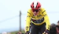 Team Visma-Lease a Bike's Danish rider Jonas Vingegaard wearing the overall leader's yellow jersey reacts as he crosses the finish line of the 5th stage of the Paris-Nice cycling race, 203,3 km between Saint-Just-en-Chevalet and La Côte-Saint-André, on March 13, 2025. Photo by Anne-Christine POUJOULAT / AFP