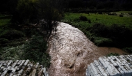 A picture taken on March 18, 2025 shows a swollen stream following storms near Constantina, north of Seville. Photo by CRISTINA QUICLER / AFP