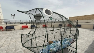 A large fish-shaped cage has been set up for students to fill with plastic bottles, which will later be recycled.