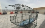 A large fish-shaped cage has been set up for students to fill with plastic bottles, which will later be recycled.