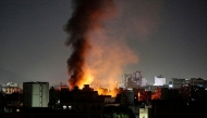 Smoke plumes rise above buildings following bombardment on Yemen's capital Sanaa on March 19, 2025. (Photo by AFP)