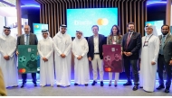 Doha Bank and Mastercard officials pose for a group photo.