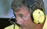 British manager Eddie Jordan looks upon his sunglasses in the pits of the Hungaroring racetrack during the first free practice session, on August 11, 2000, two days before the Hungarian Formula One Grand Prix in Budapest. Photo by Patrick HERTZOG / AFP