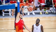 Al Arabi's Elmedin Kikanovic dunks the ball during the match.