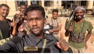 This image grab from a UGC video posted on March 21, 2025 shows Sudanese soldiers celebrating after retaking the presidential palace in Khartoum from paramilitaries. (Photo by UGC / AFP) 