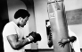 US Heavyweight boxer George Foreman (L) is seen on January 1973 during a training session in preparation for his match against Joe Frazier in Kingston. (Photo by AFP)