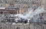 An aerial photograph taken on March 21, 2025 shows smoke billowing from a substation supplying power to Heathrow Airport amid efforts to douse the remainder of the flames after a fire broke out in Hayes, west London. (Photo by AFP)
 