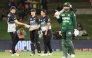 New Zealand's Zakary Foulkes (C) celebrates with Will O'Rourke (L) and Mitchell Hay after taking the wicket of Pakistan's Shaheen Shah Afridi during the fourth Twenty20 international cricket match between New Zealand and Pakistan at Bay Oval in Mount Maunganui on March 23, 2025. (Photo by Michael Bradley / AFP)