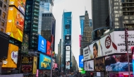 Pedestrians and cars move through the Times Square district of Manhattan, New York, on March 22, 2025. (Photo by CHARLY TRIBALLEAU / AFP)
