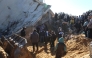 Palestinians search through the rubble of a building at the site of an Israeli strike in Khan Yunis in the southern Gaza Strip on March 23, 2025. (Photo by AFP)