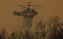 A helicopter takes part in an operation to extinguish a wildfire in Uiseong on March 24, 2025. Photo by YASUYOSHI CHIBA / AFP