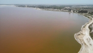 An aerial view of Lake Retba, known as the Pink Lake, in Senegal on March 19, 2025. (Photo by PATRICK MEINHARDT / AFP)
