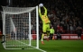 Manchester United's Cameroonian goalkeeper #24 Andre Onana saves a shot during the English Premier League football match between Nottingham Forest and Manchester United at The City Ground in Nottingham, central England, on April 1, 2025. (Photo by Paul ELLIS / AFP) 