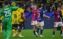 Players including Barcelona's Spanish defender #35 Gerard Martin (C) react after the UEFA Champions League quarter-final second leg football match between BVB Borussia Dortmund and FC Barcelona in Dortmund, western Germany on April 15, 2025. (Photo by Pau BARRENA / AFP)
