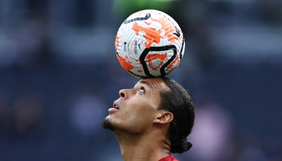 Liverpool's Dutch defender #04 Virgil van Dijk controls the ball during the warm up prior to the English Premier League football match between Tottenham Hotspur and Liverpool at Tottenham Hotspur Stadium in London, on September 30, 2023. Photo by HENRY NICHOLLS / AFP