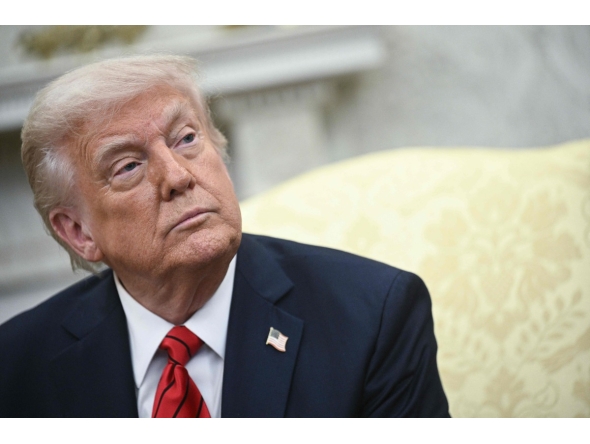 US President Donald Trump listens as he meets with Italian Prime Minister Giorgia Meloni in the Oval Office of the White House in Washington, DC, on April 17, 2025. (Photo by Brendan SMIALOWSKI / AFP)
