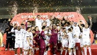 Al Sadd players and officials celebrate after winning the Ooredoo Stars League title. 