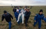 This handout picture courtesy of NASA shows NASA astronaut Don Pettit (C) being carried to a medical tent shortly after he landed in their Soyuz MS-26 spacecraft on April 20, 2025. (Photo by Bill Iingalls / NASA / AFP) 