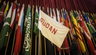 A security guard shows Sudan's national flag from that time in the main hall at the Museum of the Asian-African Conference, where the Conference was held from April 18 to 24, 1955, in Bandung, West Java on April 19, 2025, marking the 70th anniversary of the event. (Photo by Timur Matahari / AFP)