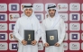 QBF President Mohammed Saad Al-Mughaiseeb and Chief Development and Asset Management Officer of Qatari Diar Fahad Abdullatif Al Jahrami pose for a picture after the signing ceremony.
