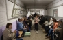 Local residents take cover in an underground shelter during a Russian missile attack in Kyiv early on April 24, 2025. (Photo by Stringer / AFP)