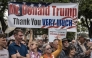 White South Africans supporting US President Donald Trump and South African and US tech billionaire Elon Musk gather in front of the US Embassy in Pretoria. (Photo by Marco Longari / AFP)
