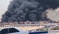 This image grab taken from footage released by the state television Islamic Republic of Iran Broadcasting News (IRIBNEWS) on April 26, 2025 shows thick black smoke billowing following an explosion at the Shahid Rajaee port dock southwest of Bandar Abbas in the Iranian province of Hormozgan. Photo by IRIBNEWS / AFP.
