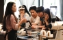 A staff member pouring coffee for guests at the Xiaowazi, or Little Hollow, coffee plantation in Pu'er. (Photo by Greg Baker / AFP) 