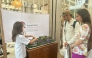 A student displays her project during the Earthna Summit.