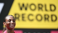 Ethiopia's Tigst Assefa smiles after crossing the line to win the women's race at the 2025 London Marathon in central London on April 27, 2025. (Photo by Justin Tallis / AFP) / 
