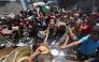 Palestinians queue for a hot meal at a charity kitchen run by the United Nation's World Food Programme (WFP) at the Nuseirat refugee camp in the central Gaza Strip on April 26, 2025. (Photo by Eyad Baba / AFP)
