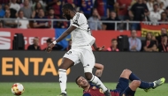 Real Madrid's German defender #22 Antonio Ruediger (L) and Barcelona's Spanish forward #07 Ferran Torres fight for the ball during their Spanish Cup, Copa del Rey (King's Cup) final football match between FC Barcelona and Real Madrid CF at La Cartuja stadium in Seville on April 26, 2025. (Photo by Josep LAGO / AFP)