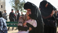 A Palestinian woman comforts another holding the body of her baby, killed in Israeli strikes on the the Abou Mahadi family home in Beit Lahia, outside the Indonesian Hospital in the northern Gaza Strip on APril 28, 2025. (Photo by BASHAR TALEB / AFP)
